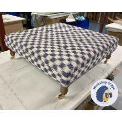 Fernworthy Shallow Buttoned Footstool with Border 91 x 91cm (36 x 36") COM Titley & Marr Chequers Indigo - Single Piped - 7ins Castor Oak Leg 8411 Fernworthy Shallow Buttoned Footstool with Border 91 x 91cm (36 x 36") COM Titley & Marr Chequers Indigo - Single Piped - 7ins Castor Oak Leg 8411