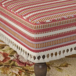 Arden Plain Top Self Piped Footstool 152 x 122cm (60 x 48") in Jane Churchill Yarra Stripe Red, with Customers Own Trim (Samuel & Sons Sophie Tassel Fringe), 26.7cm (10.5") and Turned Leg with Polished Brass Cups in Walnut Arden Plain Top Self Piped Footstool 152 x 122cm (60 x 48") in Jane Churchill Yarra Stripe Red, with Customers Own Trim (Samuel & Sons Sophie Tassel Fringe), 26.7cm (10.5") and Turned Leg with Polished Brass Cups in Walnut